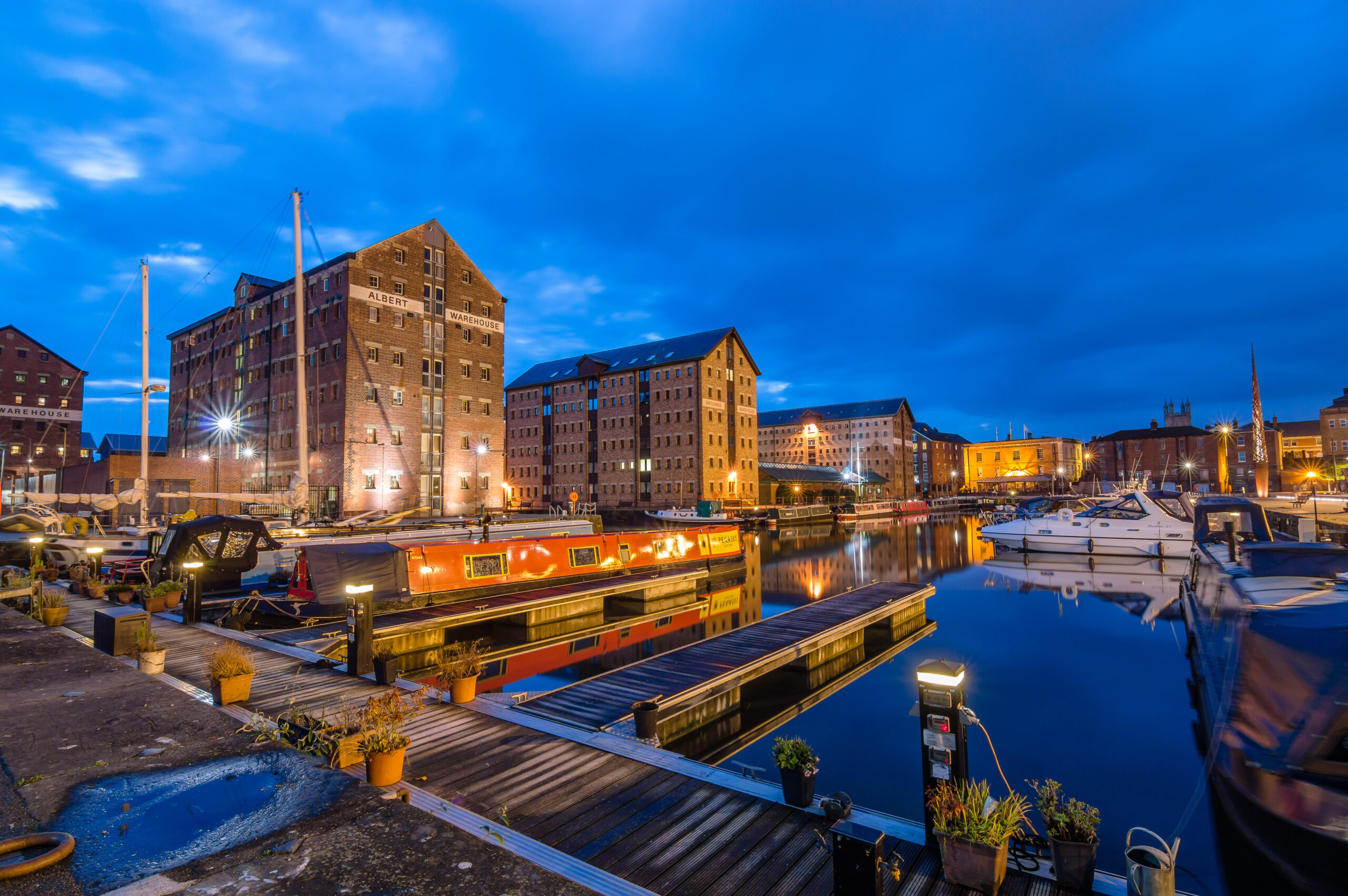 A picture of Gloucester Quays at night where we provide Pat Testing
