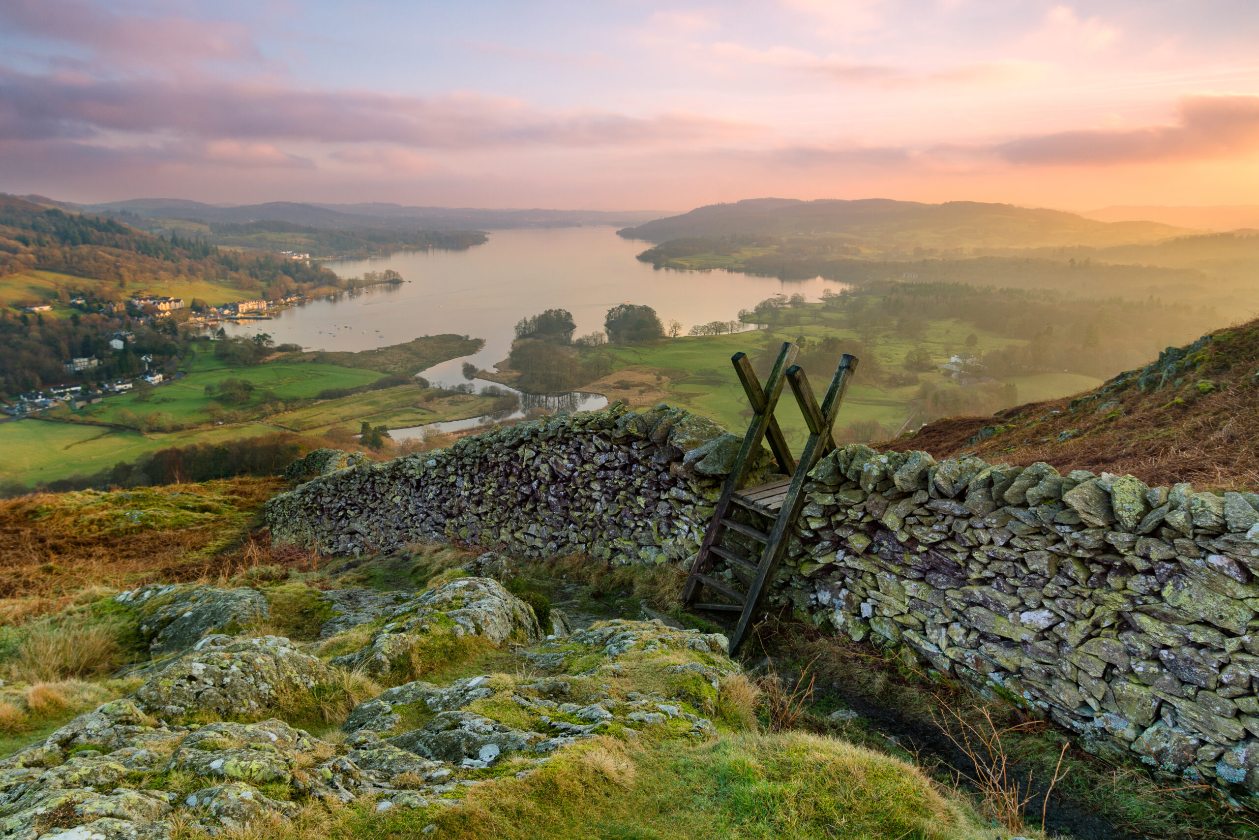 Image of hills, lakes and houses in the distance in Windermere where we do Pat testing