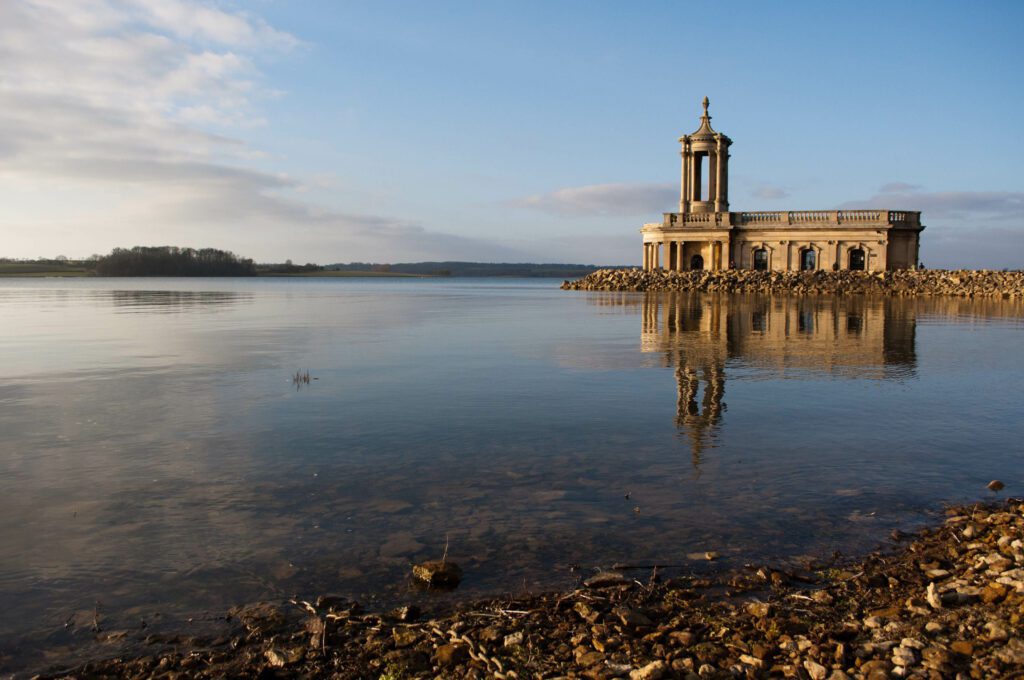 Image of a church surrounded by a lake in Rutland where we provide Pat Testing