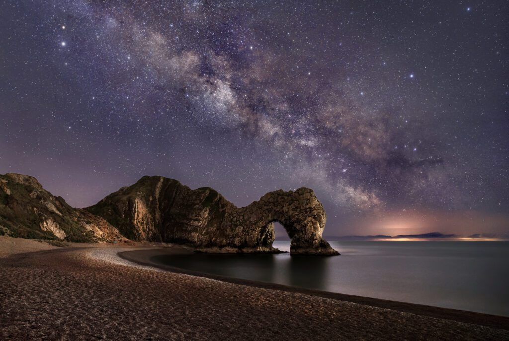 Picture of the night-sky over Durdle door in dorsetwhere we provide Pat Testing