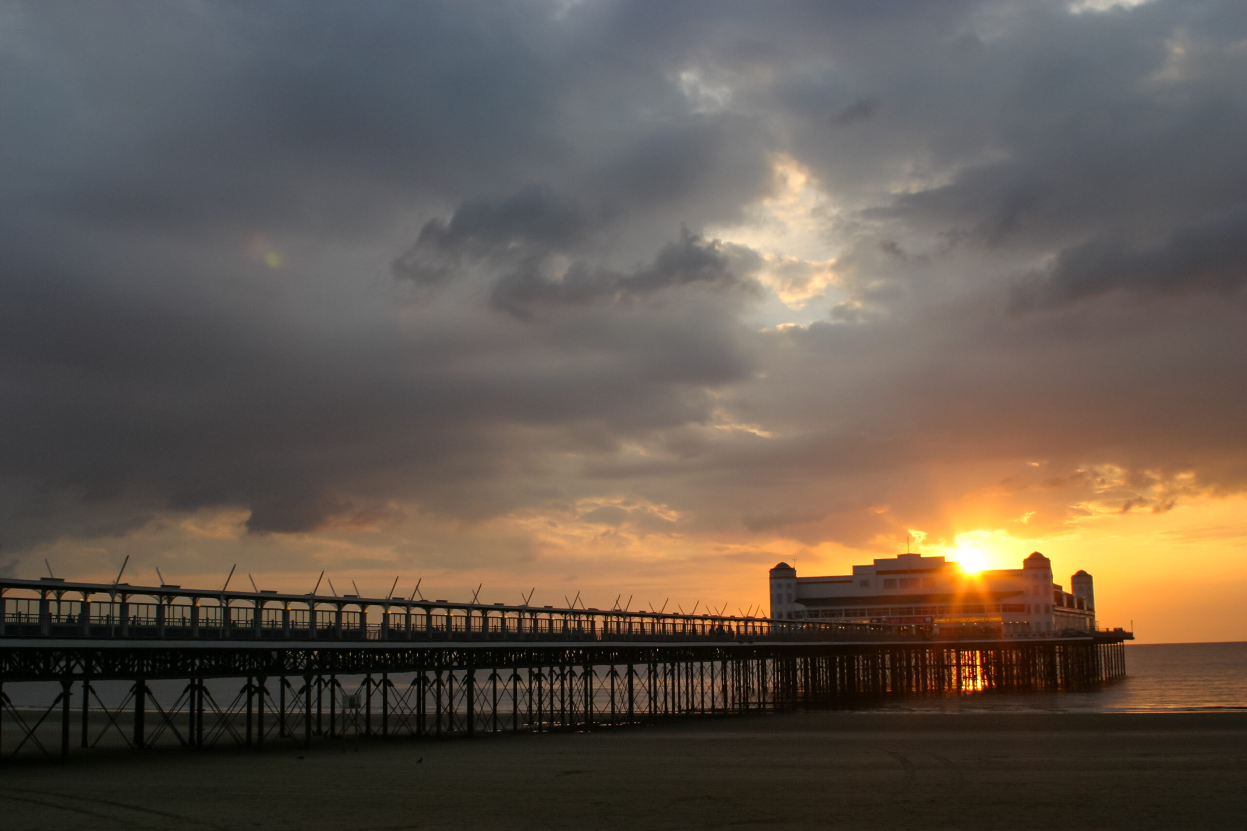 Picture of sun set over Weston Super Mare Pier where we provide Pat Testing