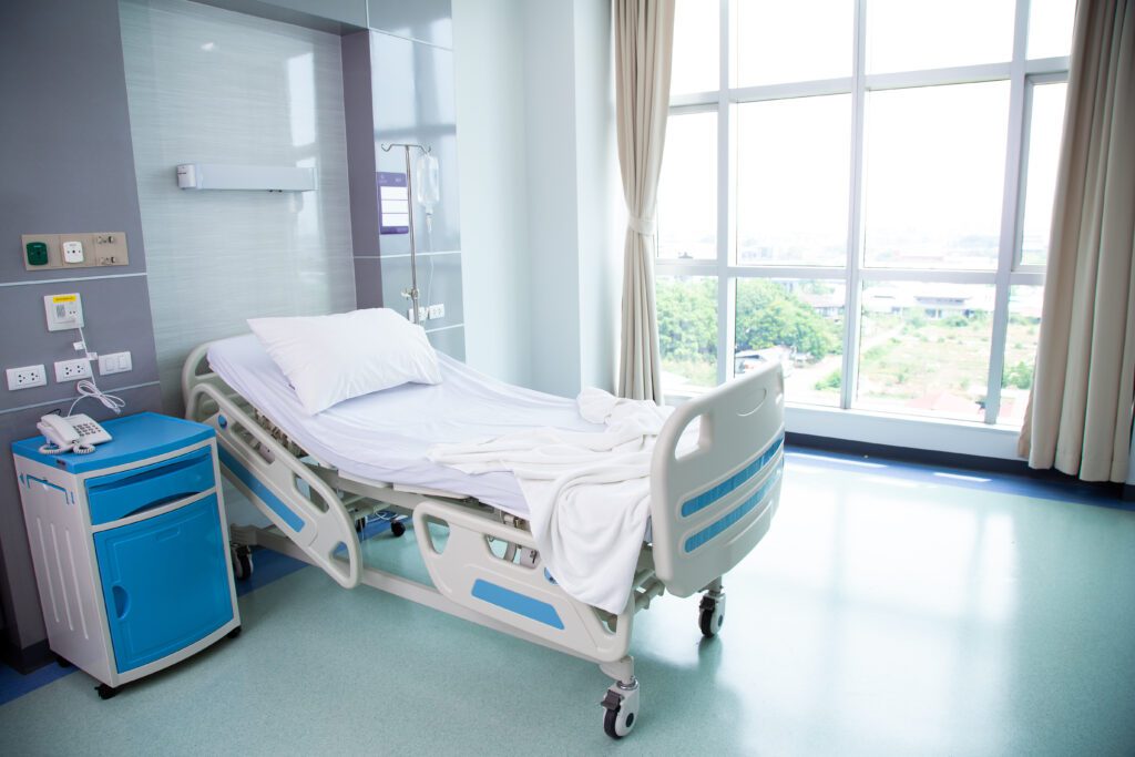 Picture of a hospital bed next to a window