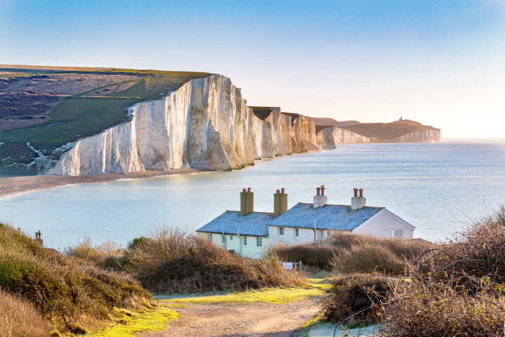 The Coast Guard Cottages and Seven Sisters Chalk Cliffs just outside Eastbourne, Sussex, England, UK