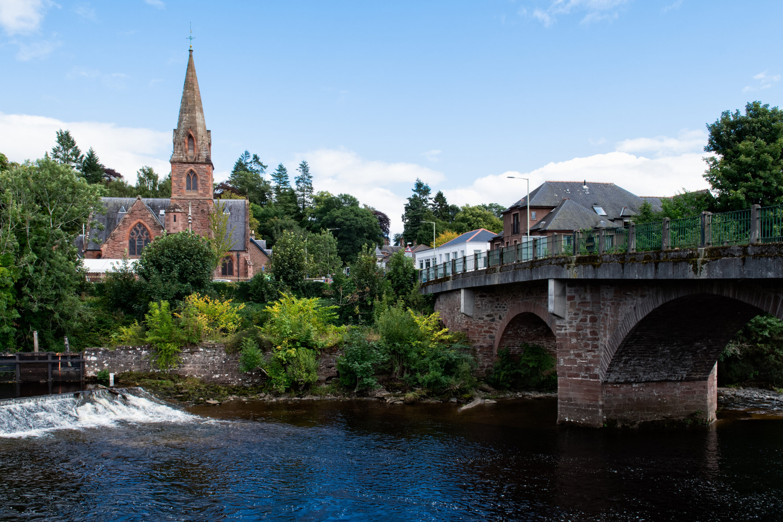 Scene at the river in Blairgowrie in Scotland. Blairgowrie Bridge, the Riverside Methodist Church and River Ericht