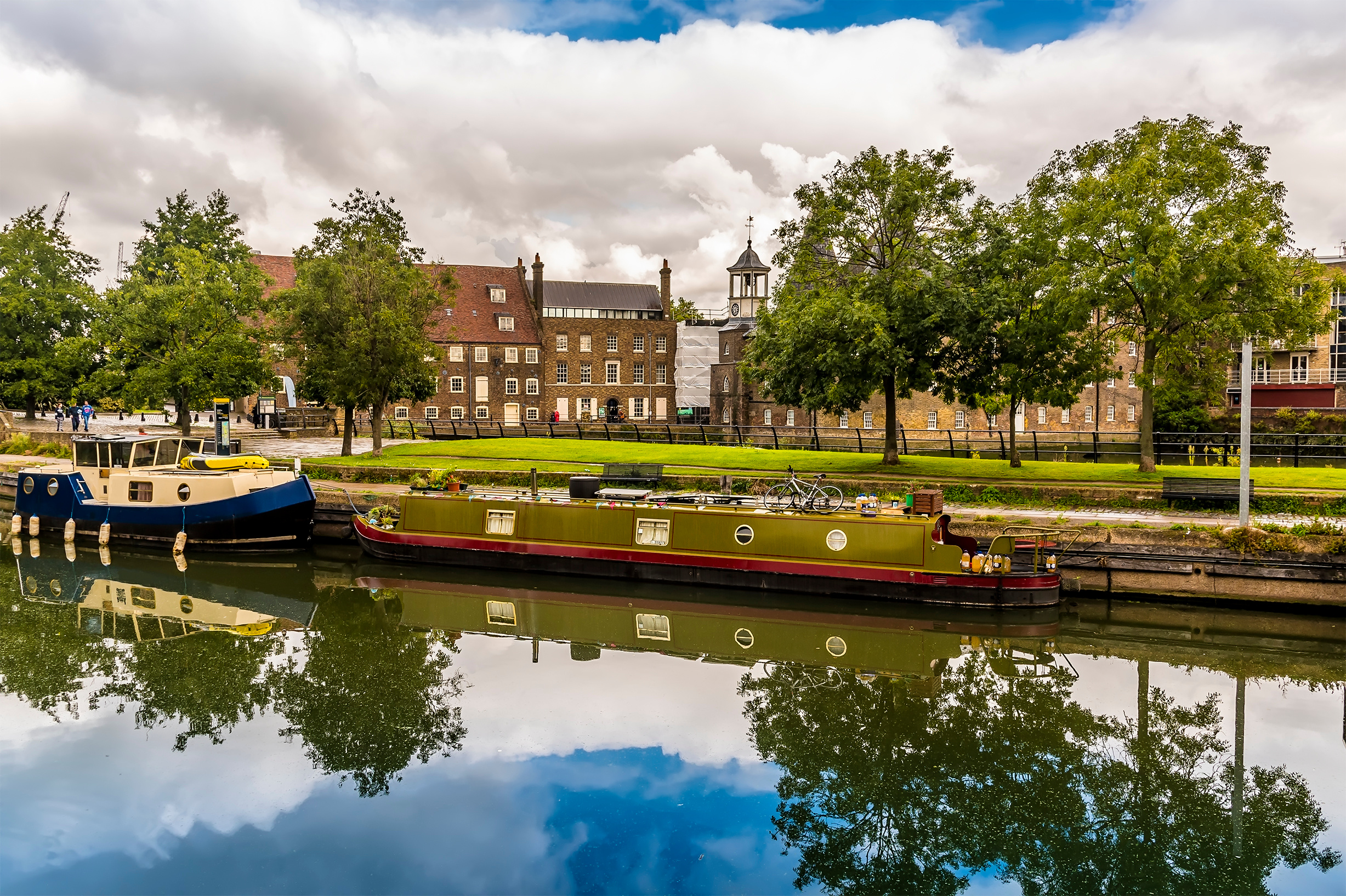 A view across the River Lee towards the Three Mills, part of the oldest tidal mills complex in the world in Lee Valley, London in the summertime
